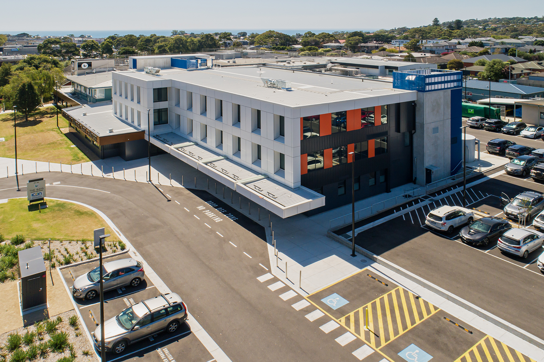 Aerial view of The Bays Cancer Care Centre and hospital campus in Mornington, with Port Phillip Bay in the distance
